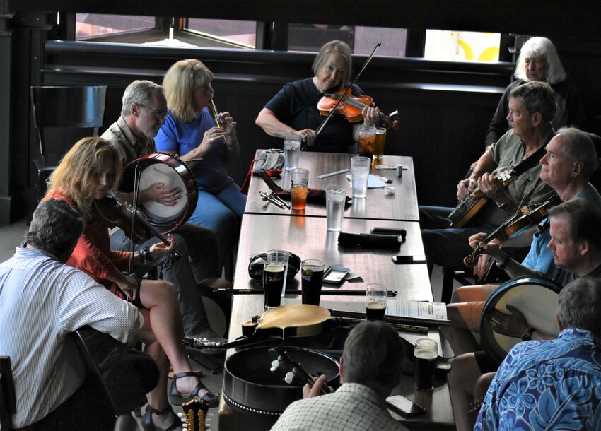 Several musicians gather for an Irish music session to perform classic Celtic tunes at the Tavern on Aug. 17, 2023.